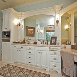 spacious master bathroom with alcove tub and corner double sink vanity